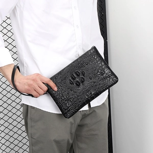 Men's black alligator embossed leather clutch with unique 3D animal claw texture design