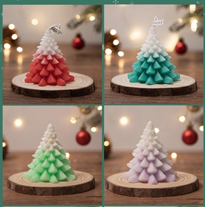 Detail showing four Christmas tree scented candles in red, blue, green, and purple gradients