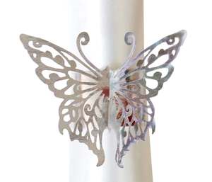 Detail of silver laser-cut butterfly napkin ring showing hollow decorative pattern