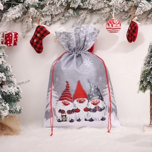 Christmas drawstring gift bag with three gnomes and snowflakes on grey linen fabric
