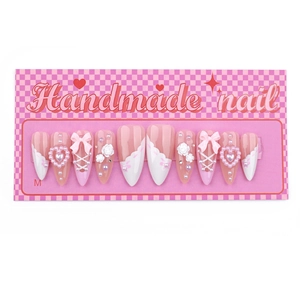 Handmade press-on nails with camellia, pearls, and pink bow design on pink gradient finish