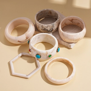 Minimalist marble resin bangles set with colorful stones on vintage gold metal bases