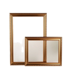 Classic Nordic vintage gold photo frames with ornate floral carvings on white background