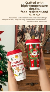 Close-up of festive Christmas ceramic cups with gingerbread and Santa Claus illustrations