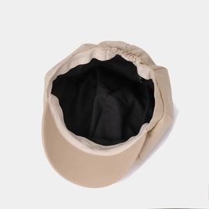 Chic beige cat ear newsboy cap with adjustable inner strap and premium twill texture