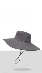 Detail of dark grey cowboy hat featuring breathable mesh vents and adjustable chin strap