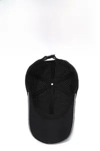 Detail of black breathable mesh baseball cap with silver reflective stripes on visor