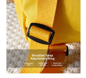 Detail of adjustable nylon strap and black plastic buckle on the yellow toddler backpack