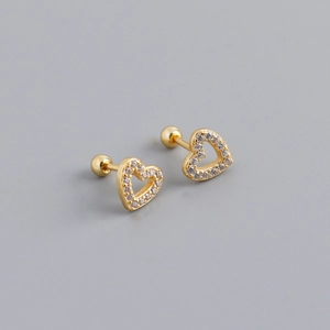Close-up of heart-shaped gold stud earrings with cubic zirconia and screw-back closure