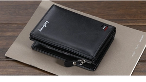 Close-up of black PU leather men's wallet with zipper on a dark wood background
