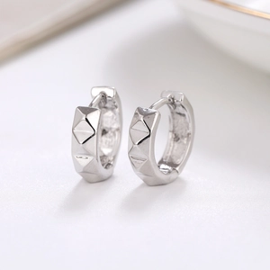 Minimalist silver geometric hoop earrings with textured pyramid pattern for women