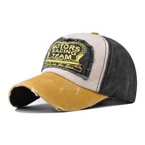 Detail of distressed vintage baseball cap with Motors Racing Team embroidery and frayed edges