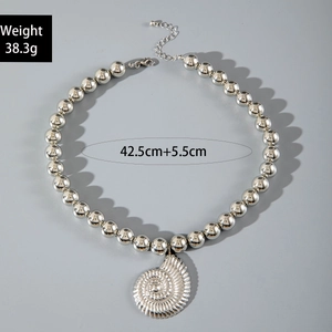 Detail of silver beaded necklace with conch pendant and adjustable extension chain