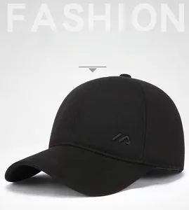 Detail view of winter baseball cap with ear flaps and thick warm cotton lining in black