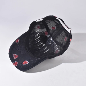 Black Chinese style baseball cap with red heart, lace mesh and distressed brim detail