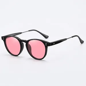 Classic round polarized sunglasses with pink transparent lenses and black frame