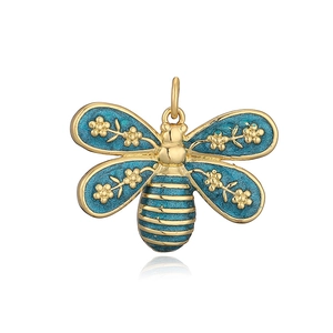 Macro detail of bee pendant featuring gold metal wings with blue enamel inlay