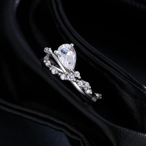 S925 sterling silver ring set with pear cut center stone and V-shaped diamond band
