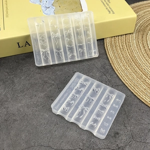 Detail of translucent silicone bow molds for DIY nail art and resin jewelry crafts
