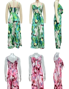 Detail view of tropical and geometric print jumpsuits with back smocking and bow tie
