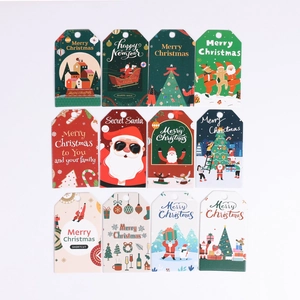 Detailed view of 12 Christmas gift tags featuring Santa, trees, and festive patterns