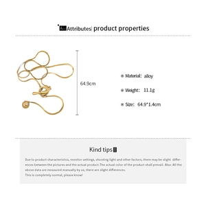 Detail view of a 64.9cm gold alloy snake chain necklace with T-bar clasp and ball charm