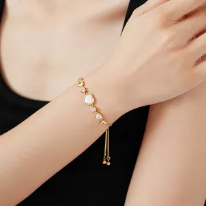Adjustable gold plated heart bracelet with mother of pearl and zircon stones