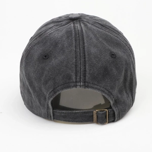 Detail view of washed denim baseball cap with adjustable metal buckle and strap on back