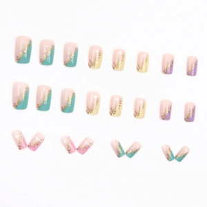 Short square press-on nails with rainbow geometric art, gold foil, and heart patterns
