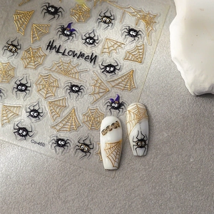 Stickers nail art Halloween avec toiles d'araignée dorées et motifs araignée noirs