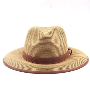 Detailed straw fedora texture showing dark khaki weave and brown leather brim stitching