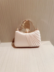 Elegant champagne satin evening clutch bag with pleated texture and pearl rhinestone handle
