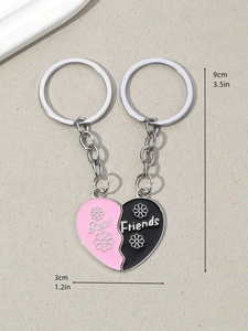 Detail of pink and black Best Friends heart keychain set with enamel finish and size data