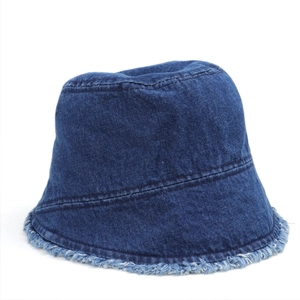 Close-up of frayed denim edges and textured stitching on blue fisherman bucket hat