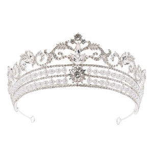 Detailed macro view of vintage silver bridal crown with rhinestones and elegant pearls