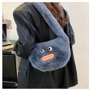 Detail of greyish blue plush crossbody bag with cute cartoon eyes and orange sausage lips