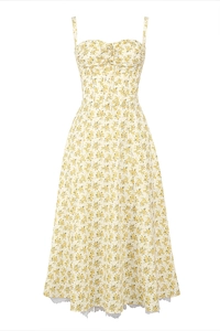 Detail view of floral midi dress with yellow flower pattern and white lace hem finish
