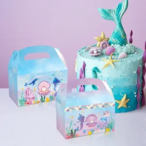 Mermaid party favor gift boxes with seashell and pearl designs in blue and pink gradient
