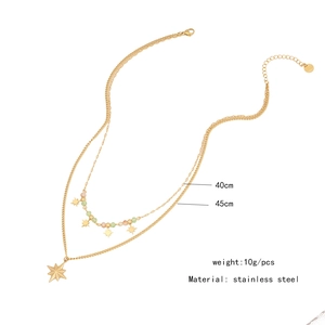 Close-up of double-layer stainless steel necklace with star pendant and colorful beads