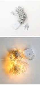 Close-up of LED string lights with warm white glow and European power plug connector