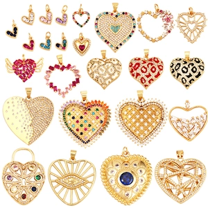 Gold plated heart pendant collection with colorful zirconia inlay on a clean background