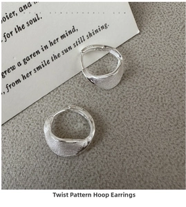 Detailed macro shot of S925 sterling silver hoop earrings with twisted spiral texture