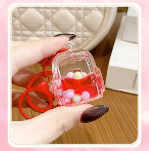 Close-up of creative liquid quicksand keychain in backpack shape with red fluid inside