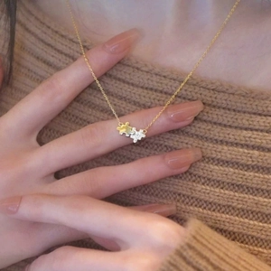S925 sterling silver puzzle pendant necklace with 14K gold plating on beige sweater