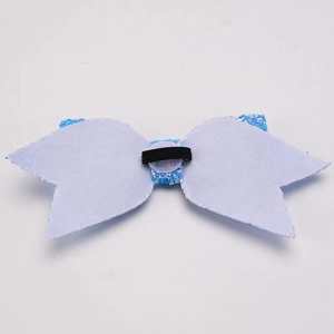 Detail of blue glitter bow back with white felt base and black elastic rubber band