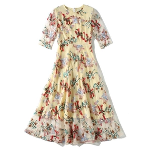 Elegant yellow dress featuring intricate heavy floral embroidery and stylish 3/4 sleeves