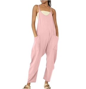 Detailed view of pink jumpsuit showing functional large side pockets and loose fit cut