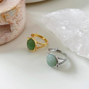 Detailed view of vintage adjustable 925 silver rings with green agate and jasper stones