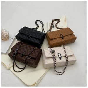 Flat lay of quilted chain crossbody bags in black, coffee, caramel and cream colors