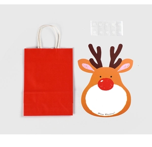 Detail of Christmas gift set with red paper bag, reindeer card and adhesive dots